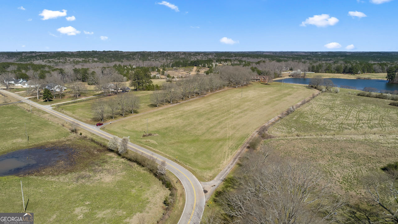 2940 East Lake Road McDonough, GA 30252 - Photo 9 of 47 a view of a swimming pool and an outdoor seating