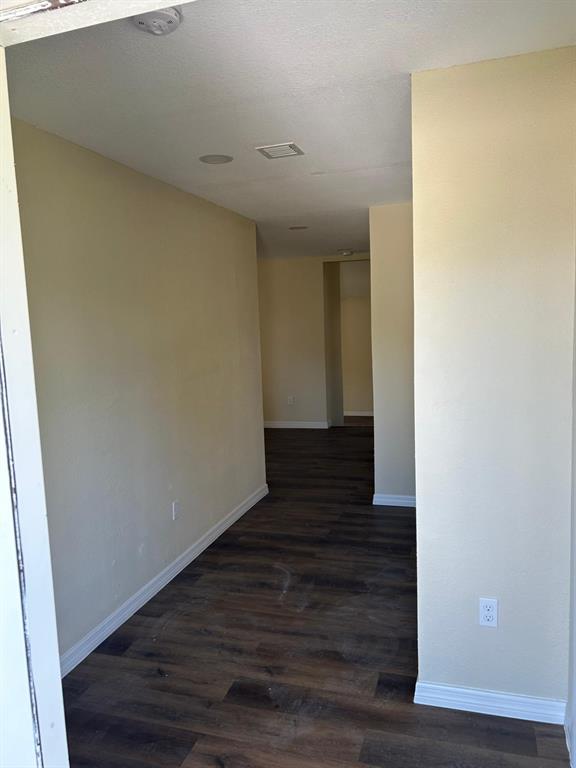 371 Banyan Avenue Pahokee, FL 33476 - Photo 12 of 17 a view of a hallway with wooden floor