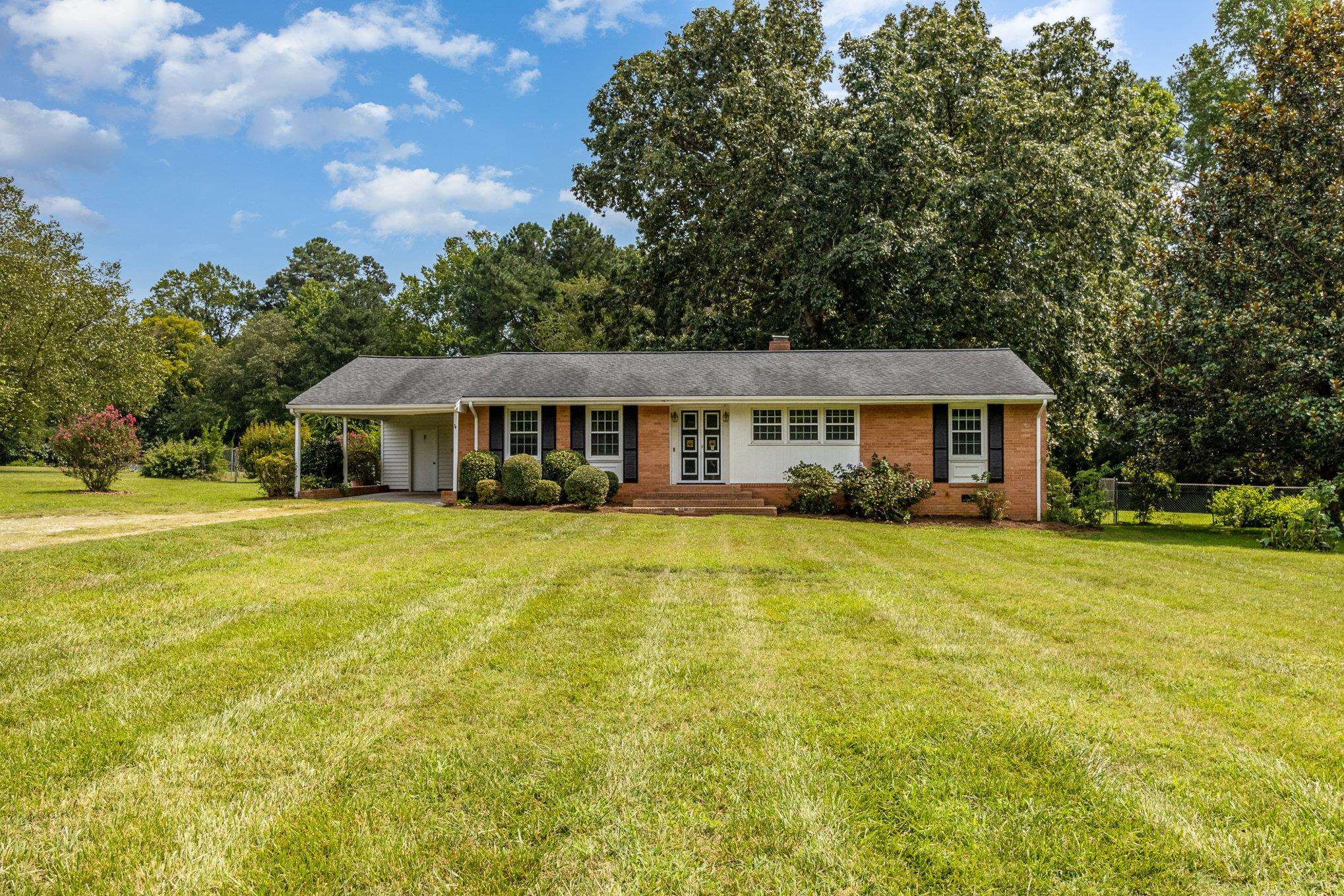 4800 Kyle Drive Raleigh, NC 27616 - Photo 2 of 36 a front view of house with yard and swimming pool