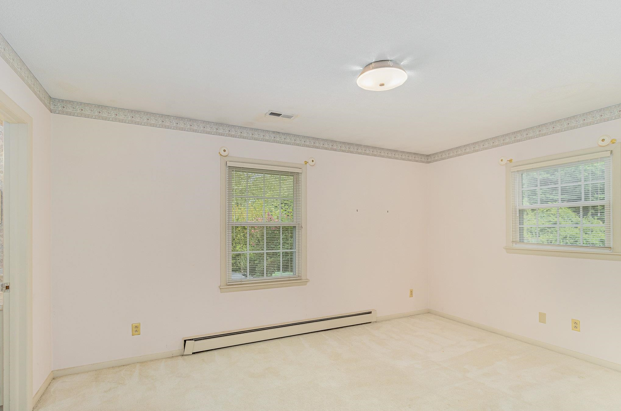 4800 Kyle Drive Raleigh, NC 27616 - Photo 26 of 36 an empty room with windows