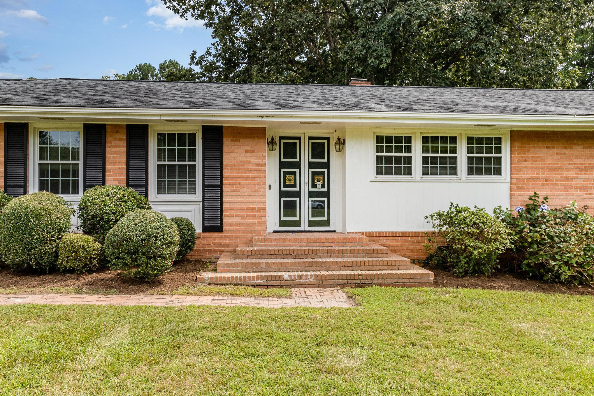 4800 Kyle Drive Raleigh, NC 27616 - Photo 3 of 36 a front view of a house with a garden