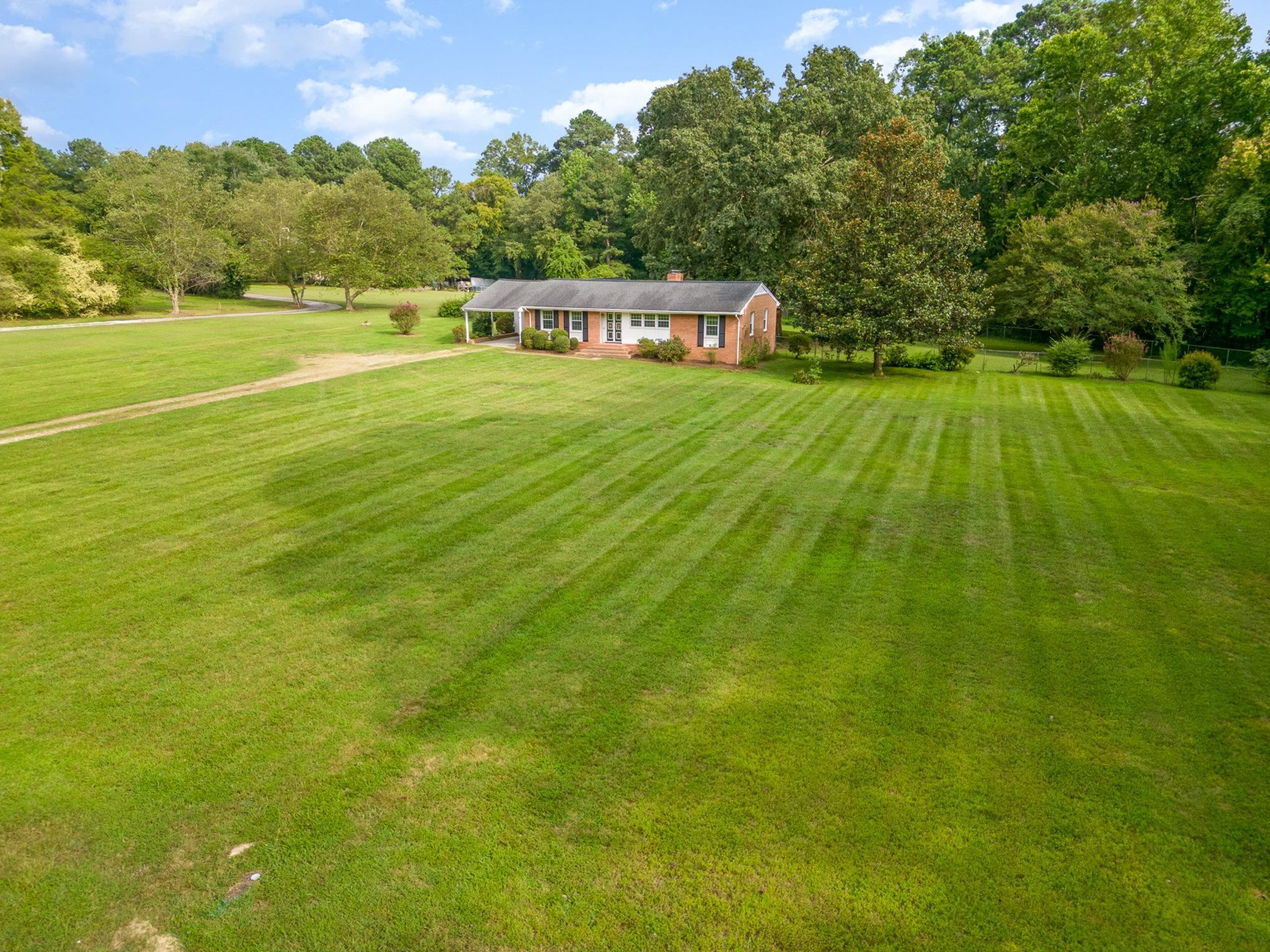 4800 Kyle Drive Raleigh, NC 27616 - Photo 4 of 36 a view of a big yard with a large trees