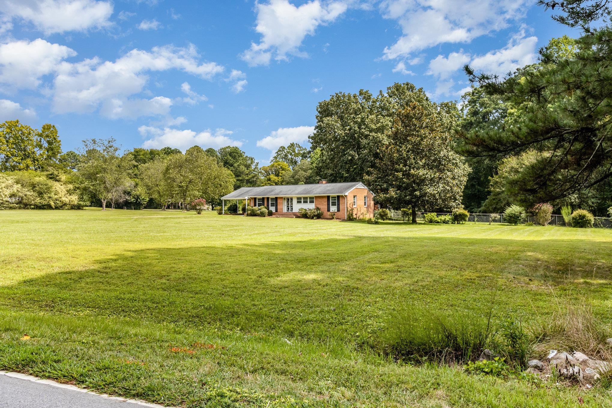 4800 Kyle Drive Raleigh, NC 27616 - Photo 5 of 36 a view of a field with an trees
