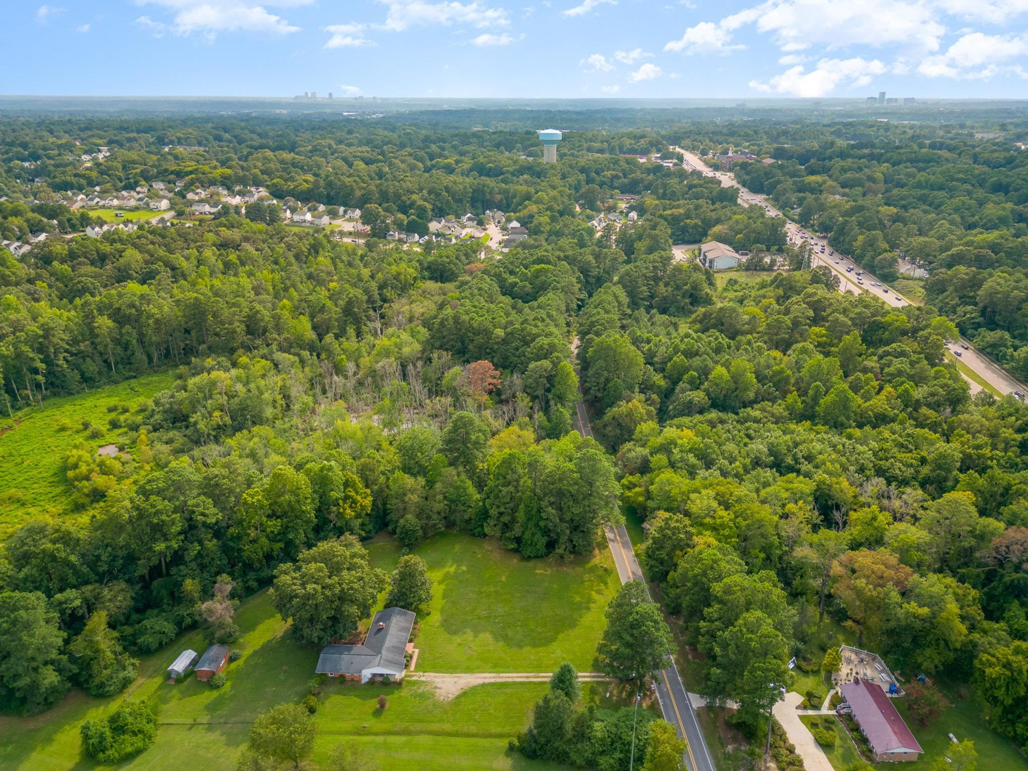 4800 Kyle Drive Raleigh, NC 27616 - Photo 7 of 36 an aerial view of residential houses with outdoor space and trees