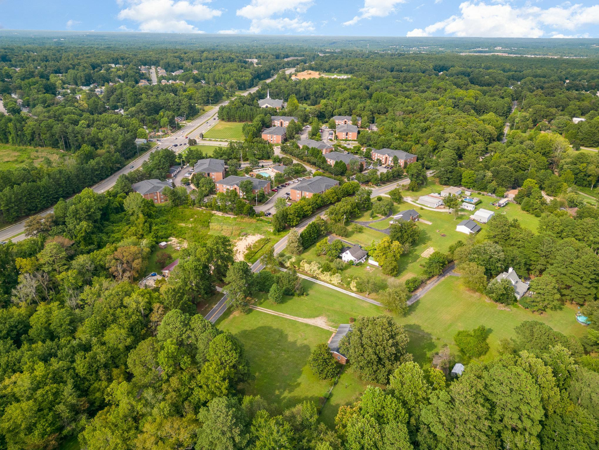 4800 Kyle Drive Raleigh, NC 27616 - Photo 8 of 36 an aerial view of residential houses with outdoor space and trees