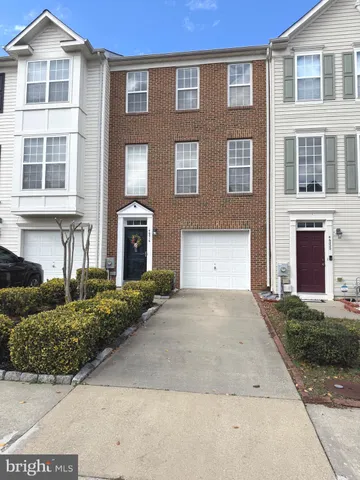 a view of backyard with barbeque grill and wooden fence