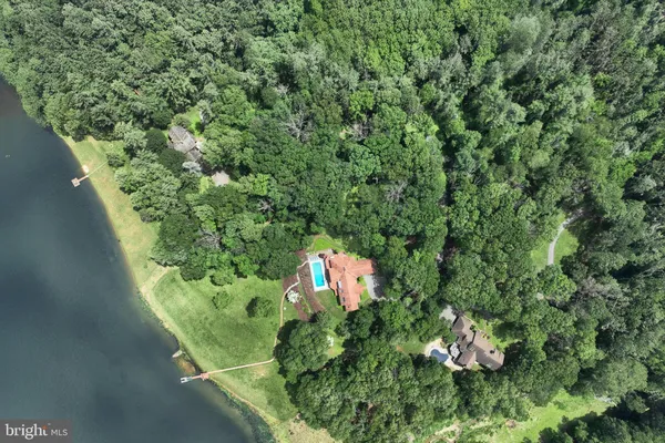 a bedroom with two beds and a lamp