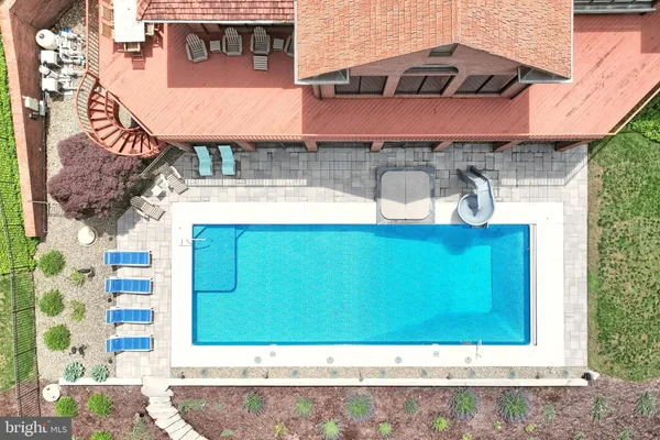 a view of a hallway with wooden walls