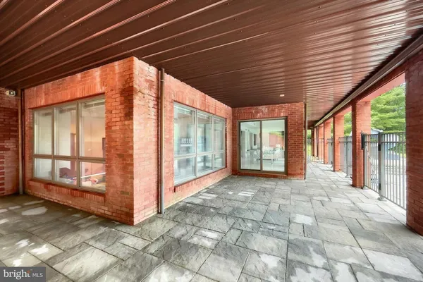 a living room with furniture a fireplace and a chandelier