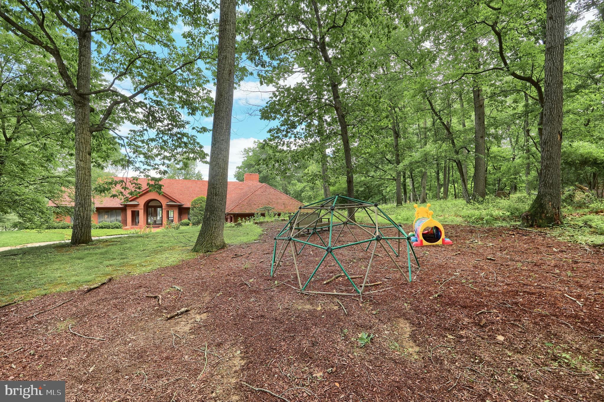 174 Springhouse Lane Spring Grove, PA 17362 - Photo 30 of 95 a view of a house with a yard and sitting area