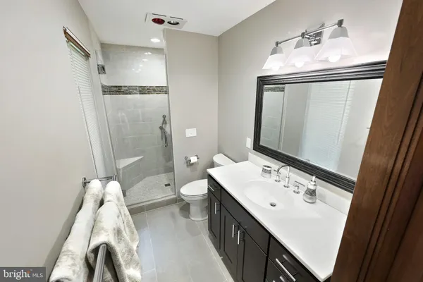 a kitchen with a table and chairs