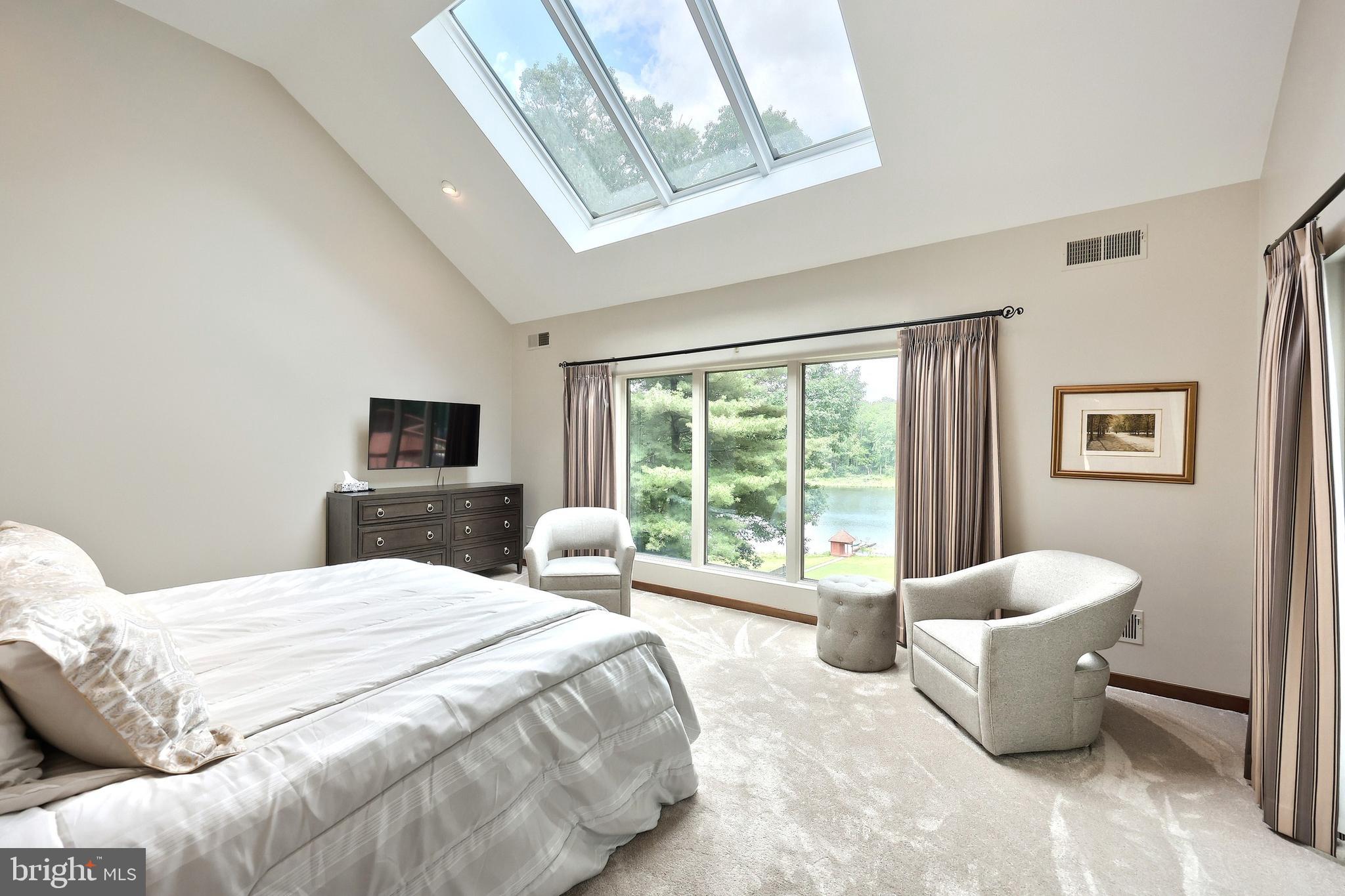 174 Springhouse Lane Spring Grove, PA 17362 - Photo 34 of 95 a spacious bedroom with a bed and a couch