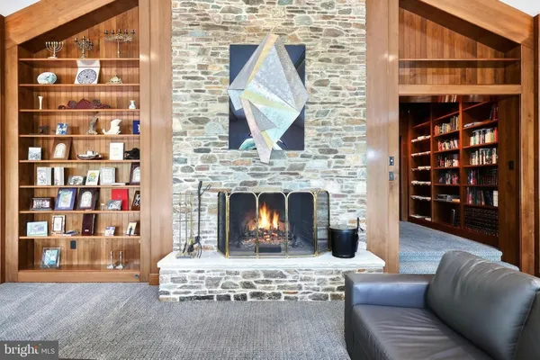 an aerial view of a house with a yard and garden