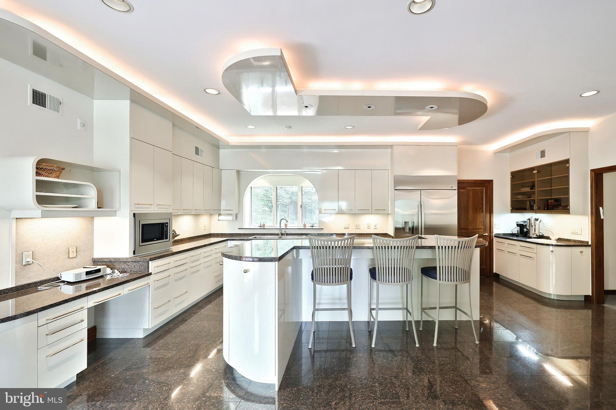 174 Springhouse Lane Spring Grove, PA 17362 - Photo 60 of 95 a kitchen with stainless steel appliances granite countertop a stove top oven a sink dishwasher and white cabinets with wooden floor