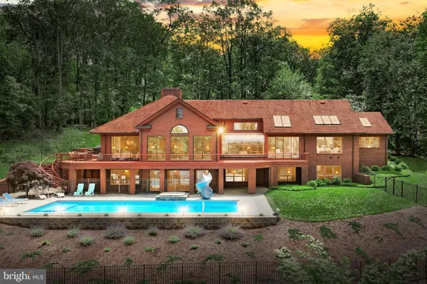 a view of a patio with chairs next to a yard