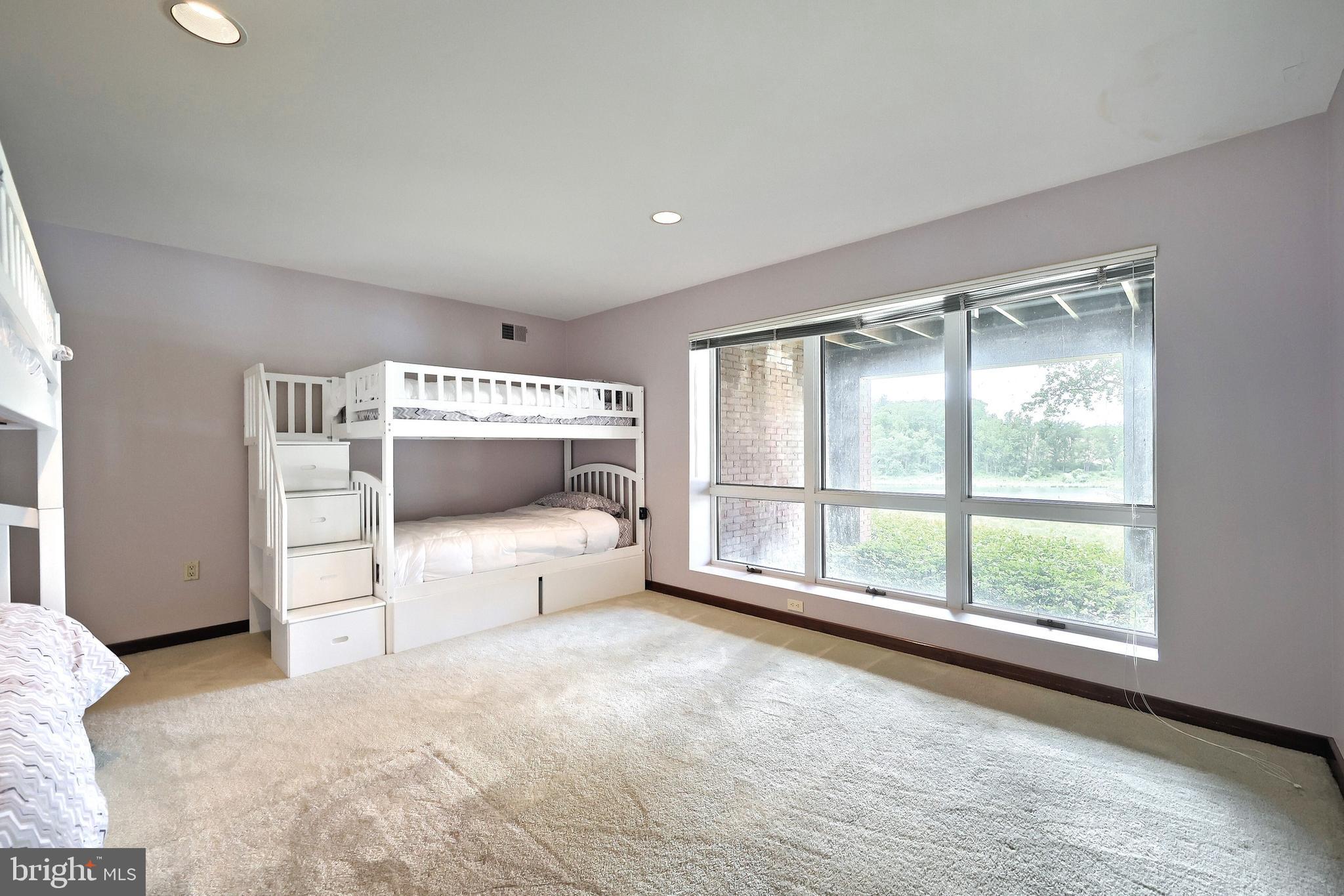174 Springhouse Lane Spring Grove, PA 17362 - Photo 72 of 95 a spacious bedroom with a large bed and a large window