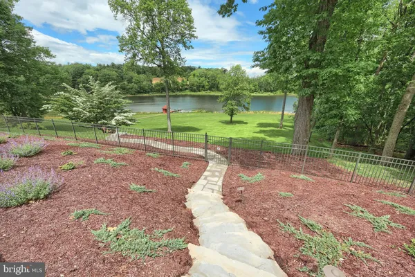 a view of backyard with backyard and floor to ceiling window