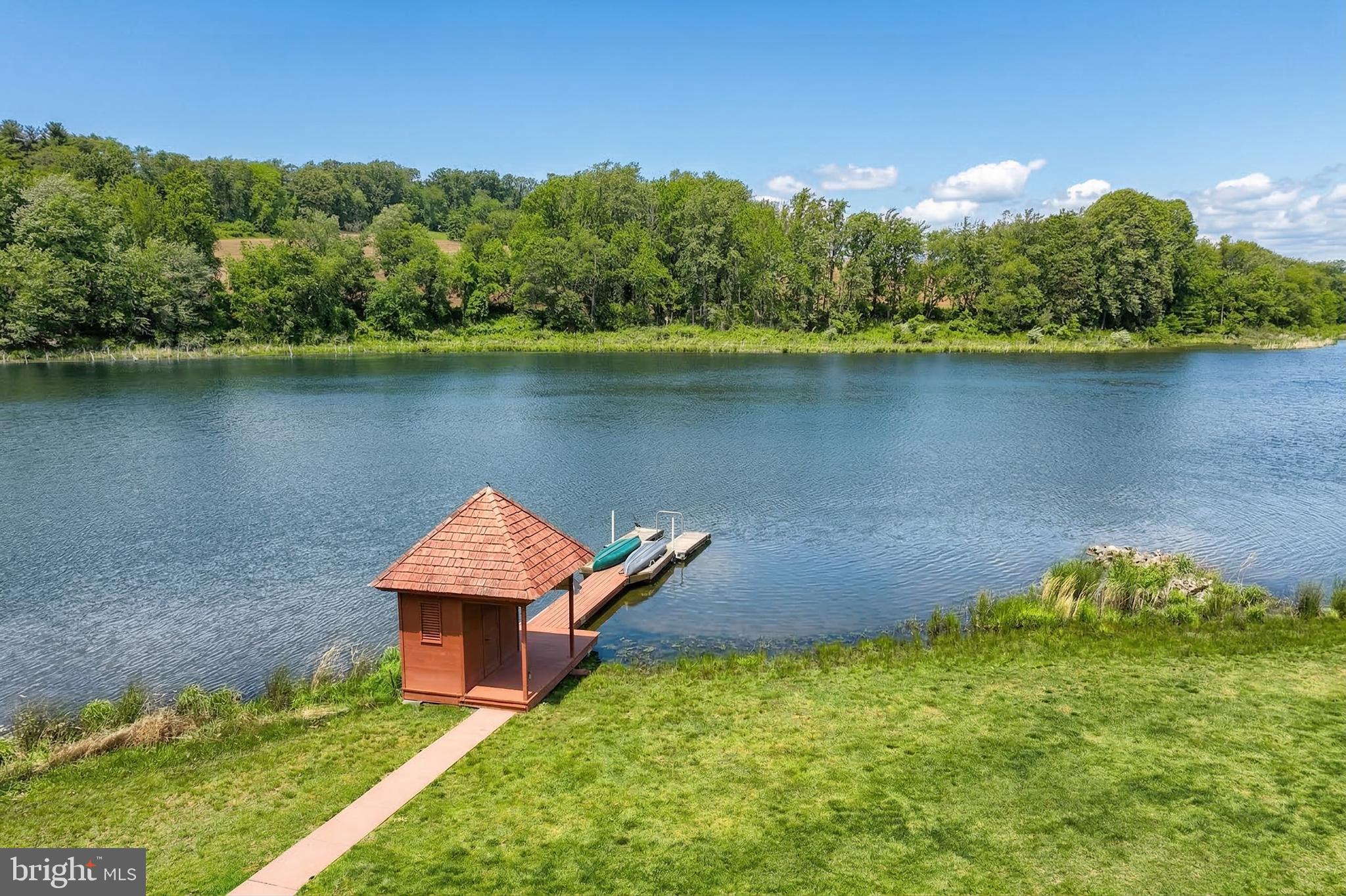 174 Springhouse Lane Spring Grove, PA 17362 - Photo 10 of 95 an aerial view of a house with a garden and lake view