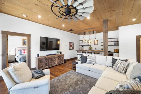 a view of living room with furniture and flat screen tv