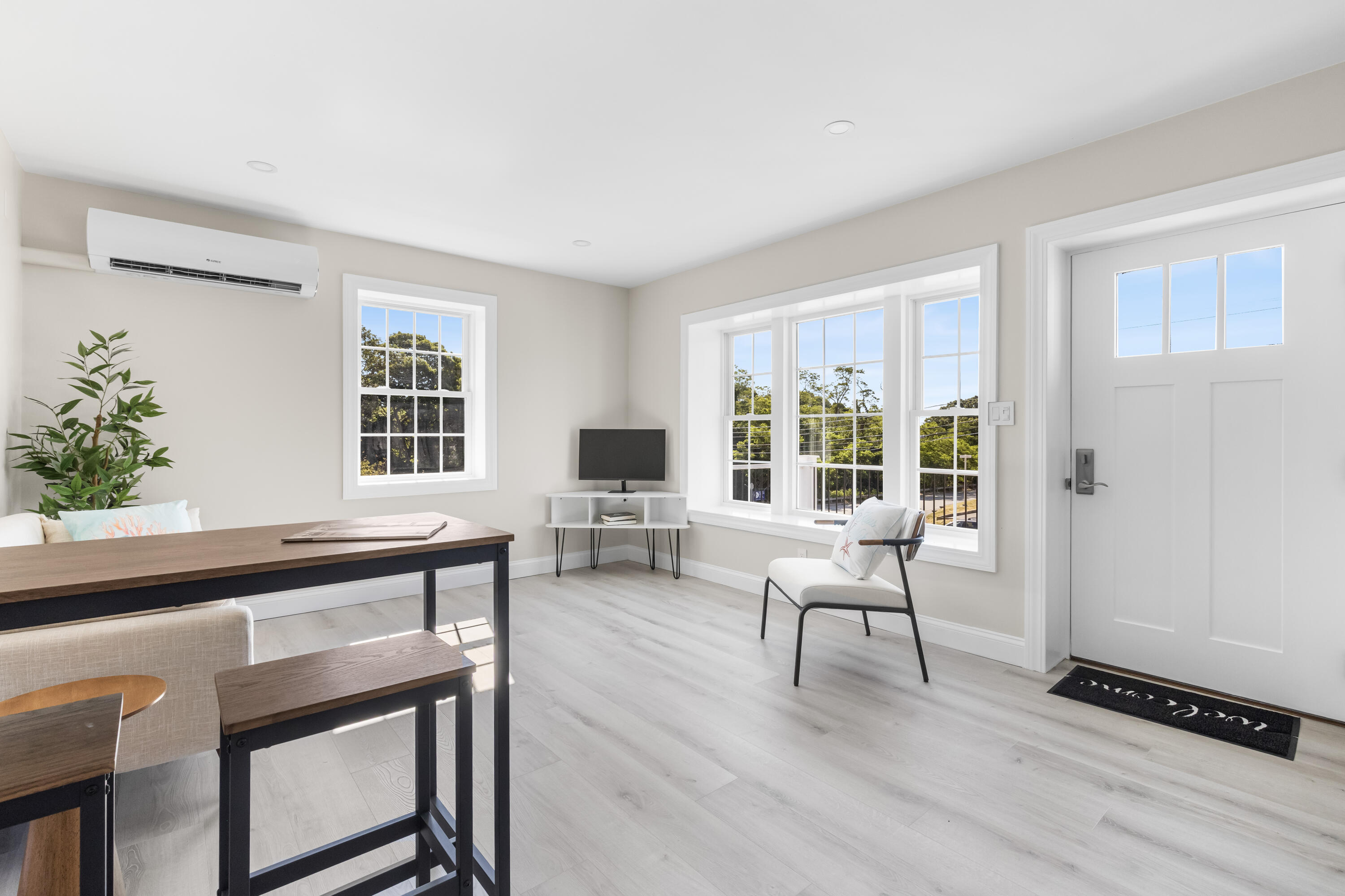 112 West Main Street, Unit 8 Hyannis, MA 02601 - Photo 6 of 13 a living room with furniture and windows