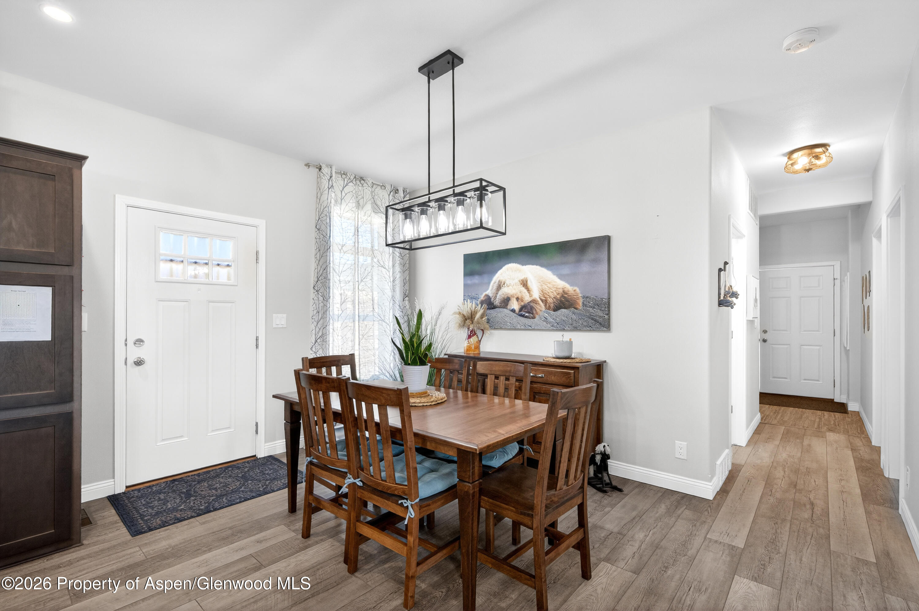 19 County Road 301 Parachute, CO 81635 - Photo 15 of 35 a view of a dining room with furniture wooden floor and chandelier