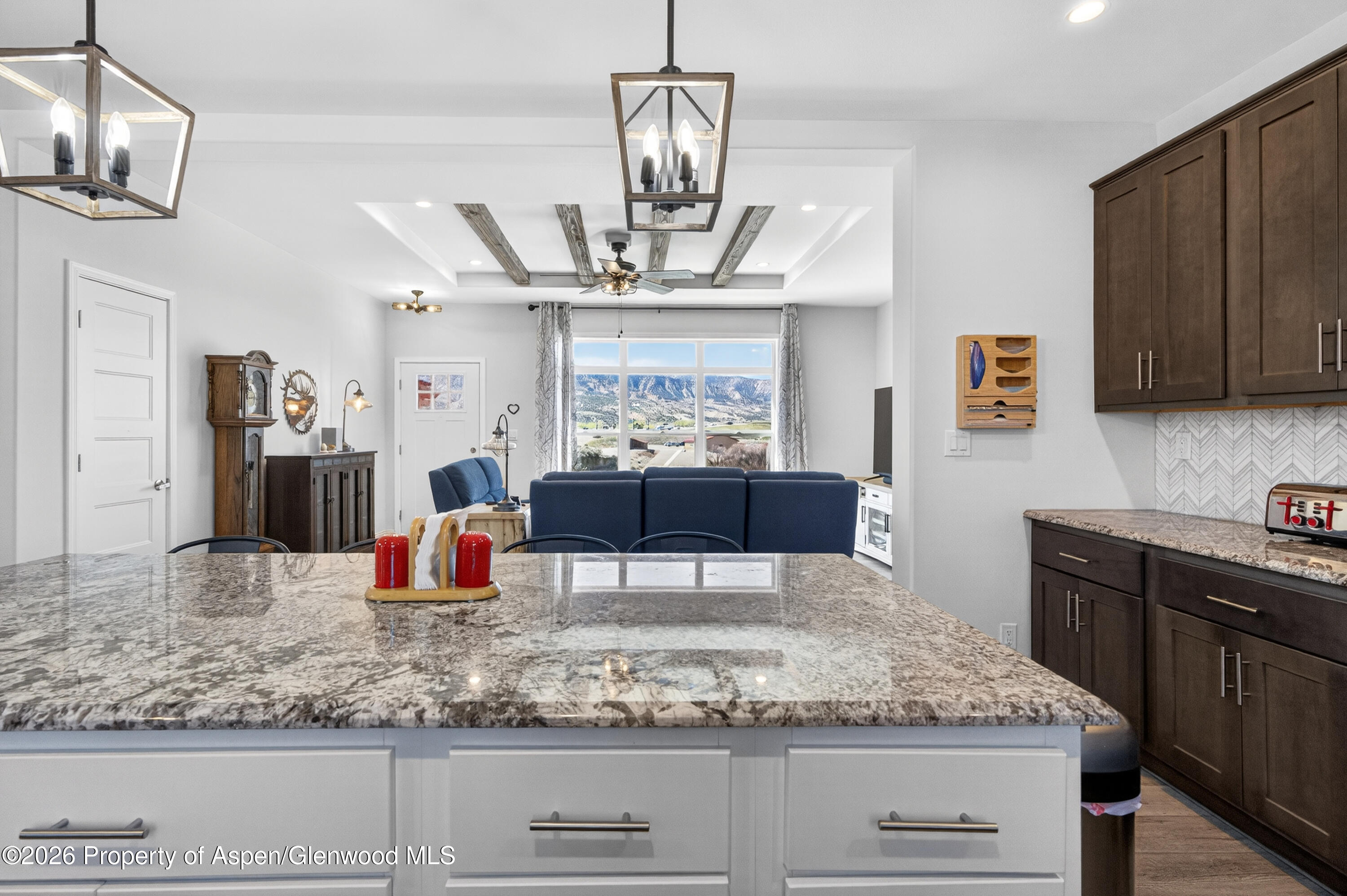 19 County Road 301 Parachute, CO 81635 - Photo 18 of 35 a view of a kitchen with granite countertop a table and chairs in it