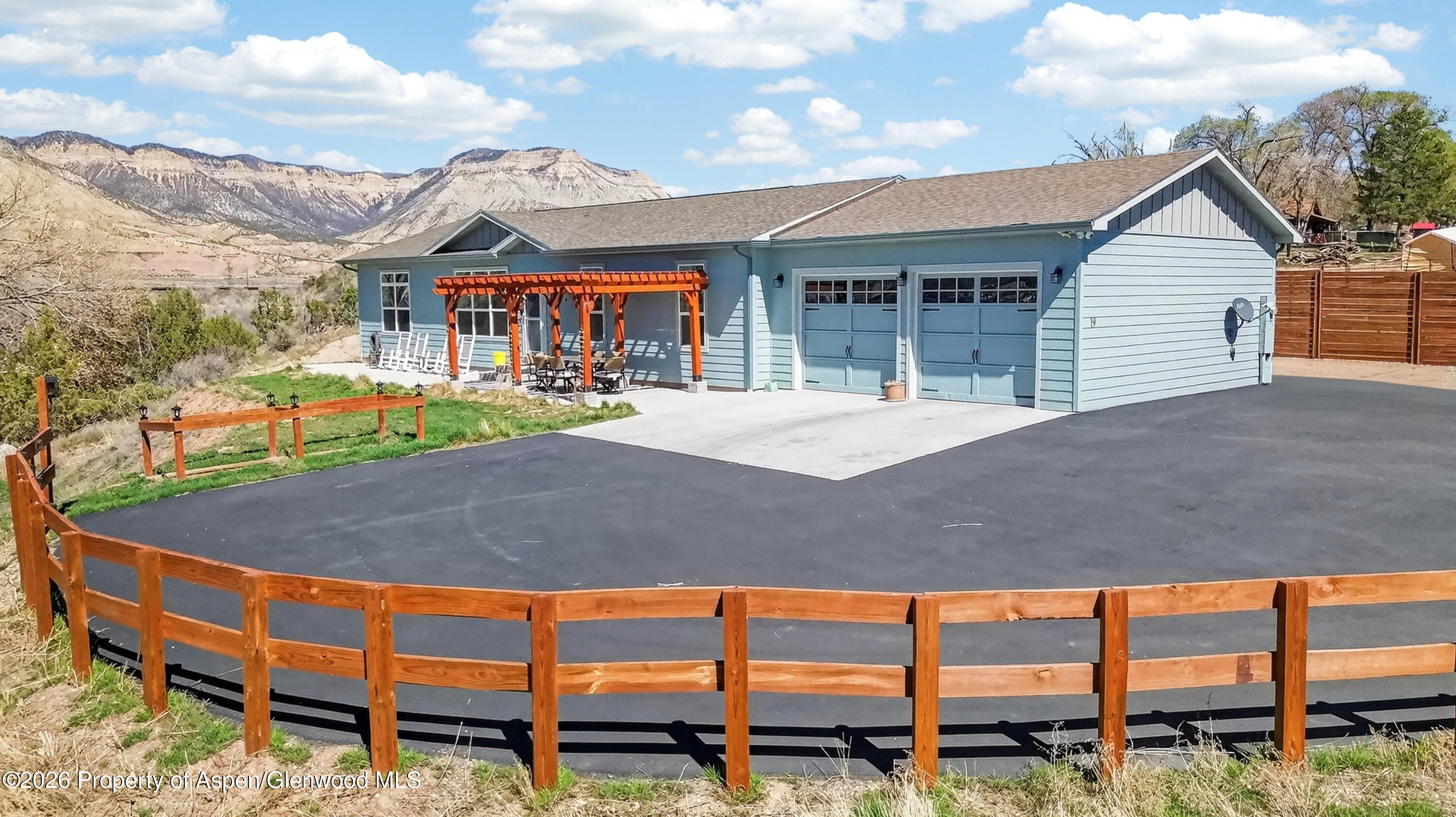 19 County Road 301 Parachute, CO 81635 - Photo 2 of 35 a view of a house with a yard and sitting area