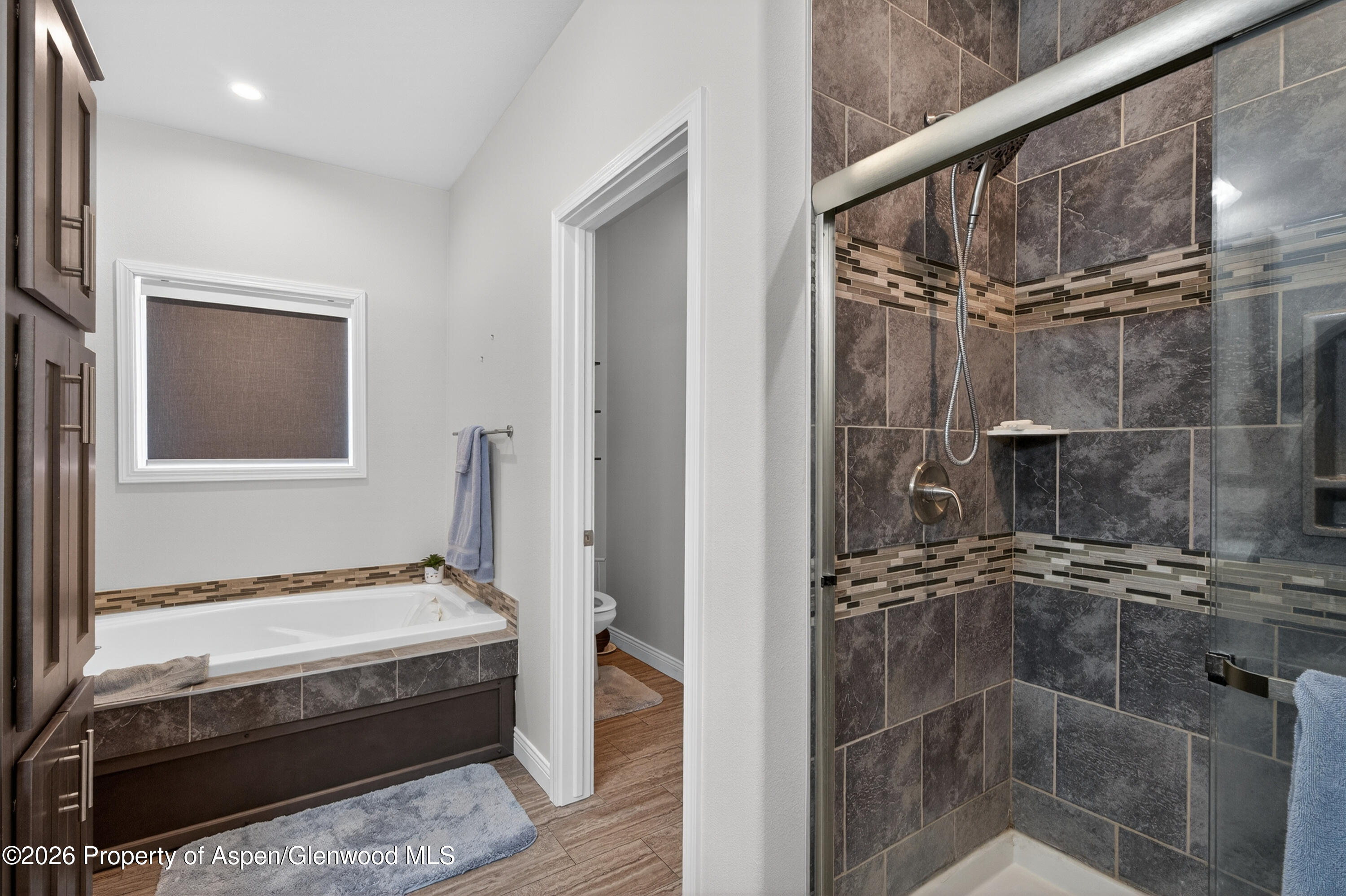 19 County Road 301 Parachute, CO 81635 - Photo 23 of 35 a bathroom with a granite countertop sink a mirror and shower