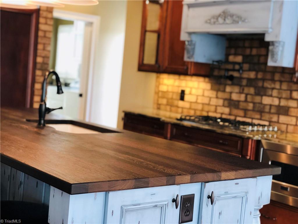 150 Jd Essick Road Lexington, NC 27295 - Photo 14 of 49 Simply beautiful, huge custom built island provides tons of space for food prep or casual dining