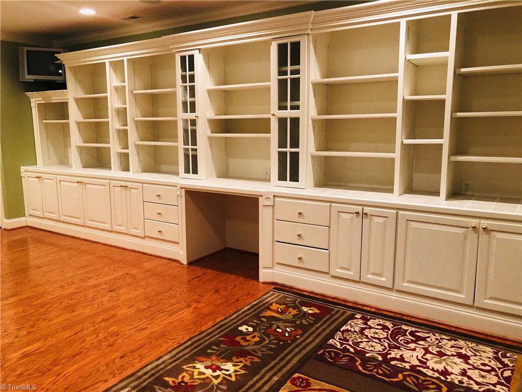 150 Jd Essick Road Lexington, NC 27295 - Photo 33 of 49 Spacious library in basement is loaded with built-ins, perfect for storing your favorite reads... This room has it's own full bath and could be used as a 5th bedroom/teen/in-law quarters.