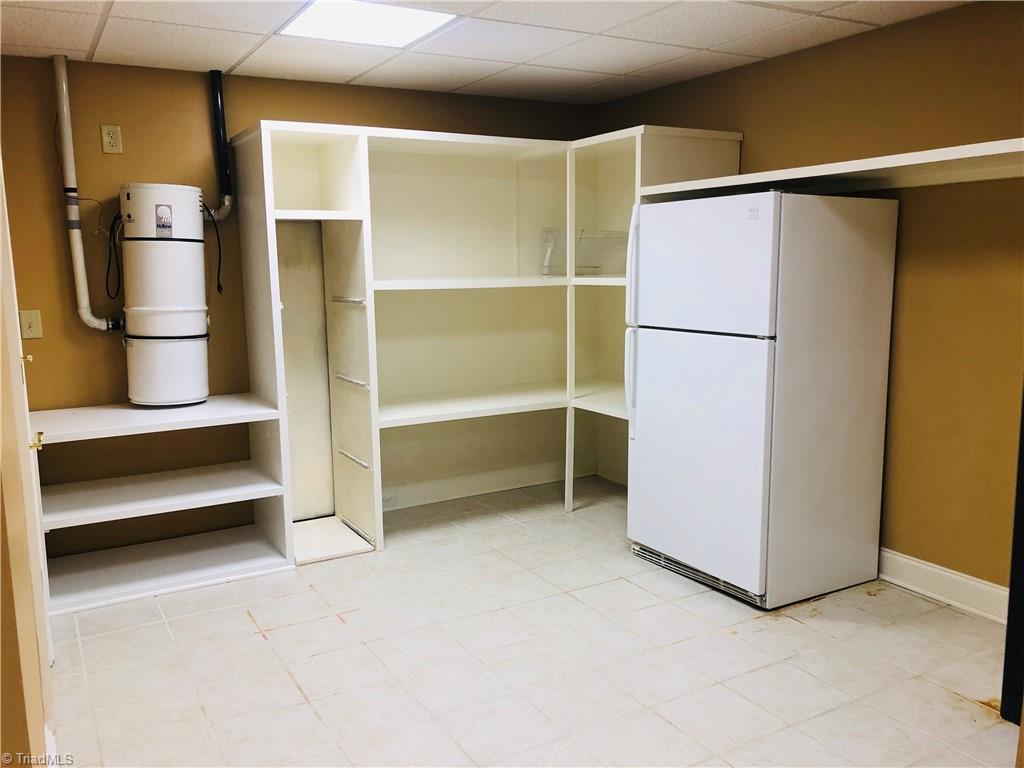 150 Jd Essick Road Lexington, NC 27295 - Photo 37 of 49 This home is loaded with storage.. This storage room is located in the basement with plenty of space for an additional refrigerator (or two).