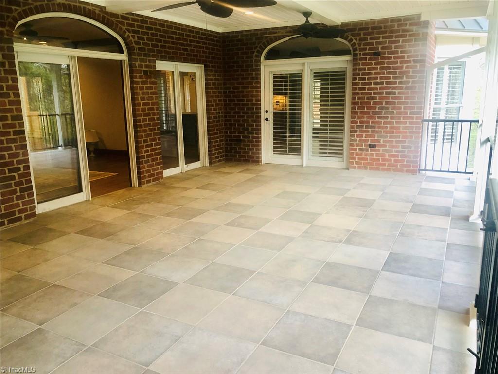 150 Jd Essick Road Lexington, NC 27295 - Photo 38 of 49 Large, covered porch opens to family room and kitchen and overlooks backyard with a lake view.