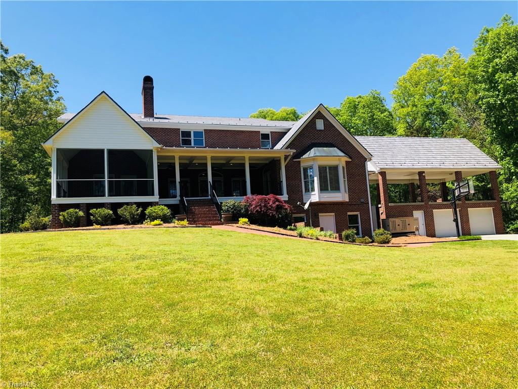 150 Jd Essick Road Lexington, NC 27295 - Photo 41 of 49 Rear view of the home (from lake side). Garage space is perfect for storing lawn equipment, etc. etc....