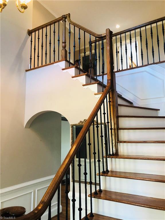 150 Jd Essick Road Lexington, NC 27295 - Photo 8 of 49 Stairwell from open foyer leads to upstairs with 3 bedrooms and 2 baths.