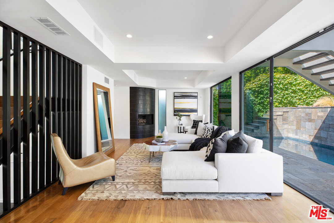 640 East Channel Road Santa Monica, CA 90402 - Photo 12 of 45 a living room with furniture and large windows