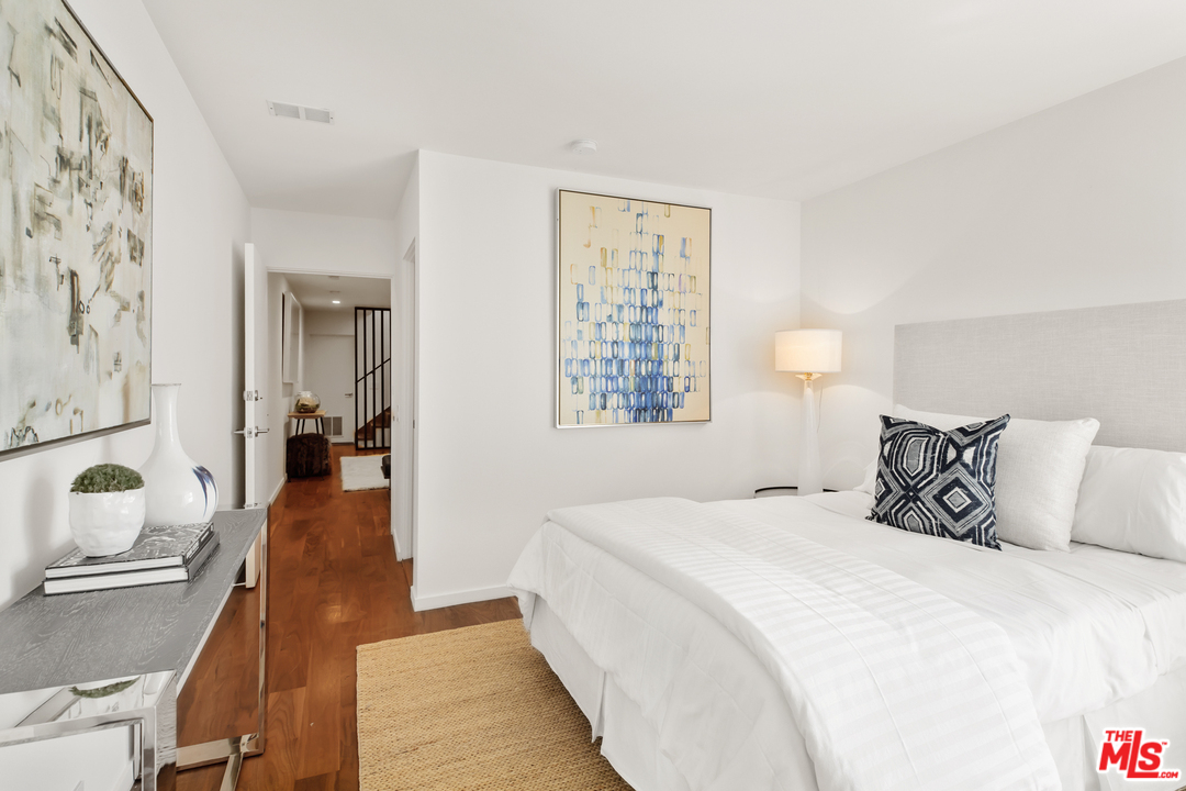 640 East Channel Road Santa Monica, CA 90402 - Photo 16 of 45 a bedroom with a bed and a lamp with the dresser