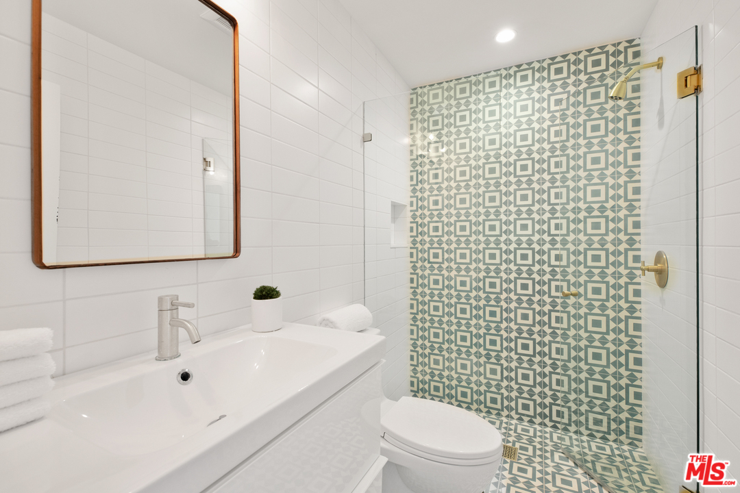 640 East Channel Road Santa Monica, CA 90402 - Photo 17 of 45 a bathroom with a sink toilet and shower