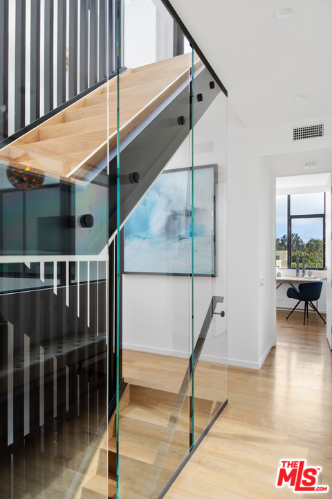 640 East Channel Road Santa Monica, CA 90402 - Photo 18 of 45 a dinning room with table and stairs