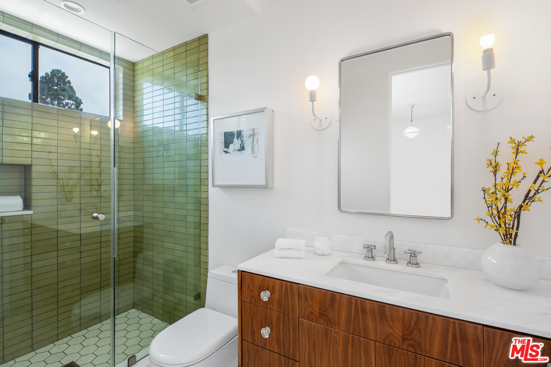640 East Channel Road Santa Monica, CA 90402 - Photo 20 of 45 a bathroom with a sink vanity granite toilet and shower