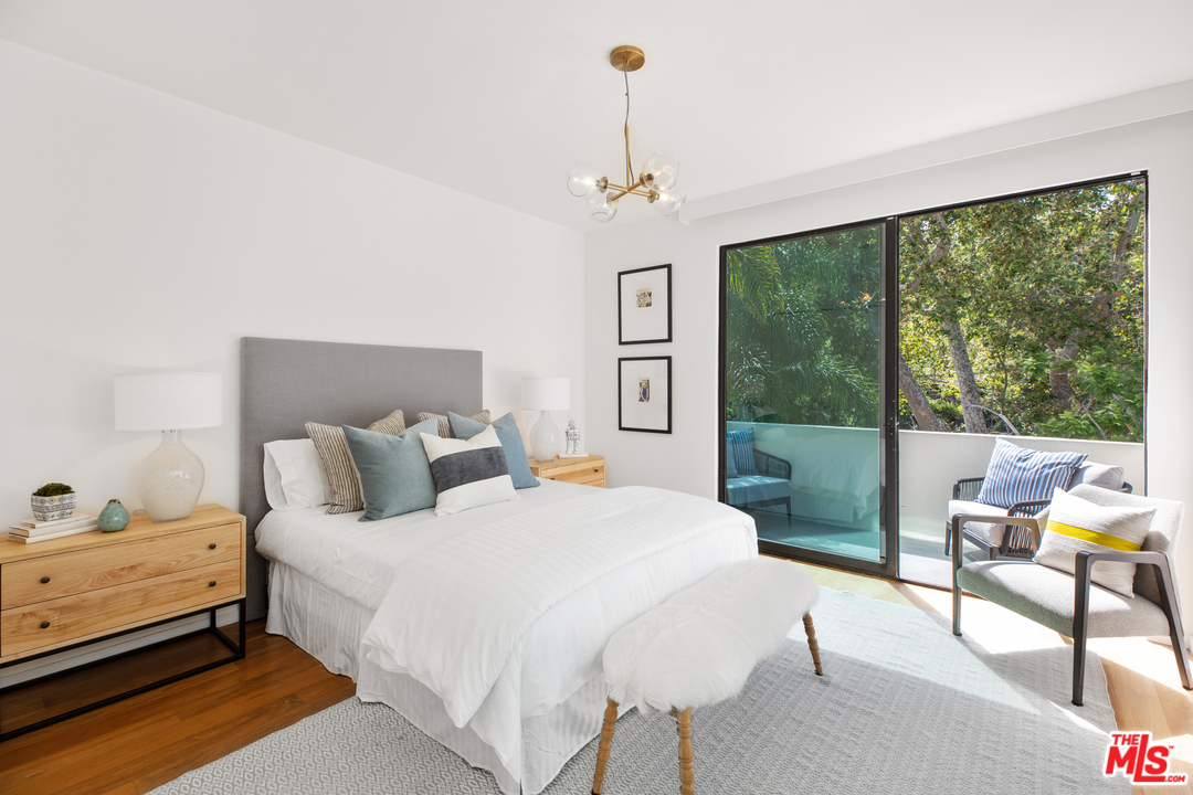 640 East Channel Road Santa Monica, CA 90402 - Photo 21 of 45 a bedroom with a bed and a window