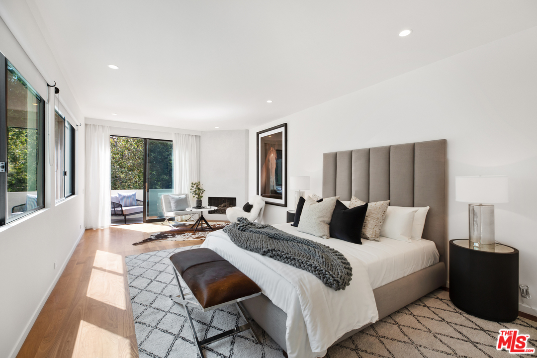 640 East Channel Road Santa Monica, CA 90402 - Photo 23 of 45 a bedroom with a bed and glass window