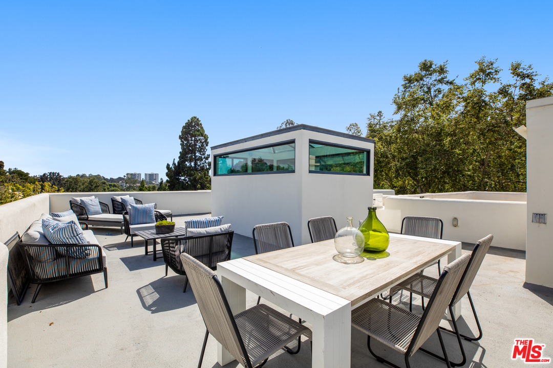 640 East Channel Road Santa Monica, CA 90402 - Photo 32 of 45 a view of a terrace with furniture and stove
