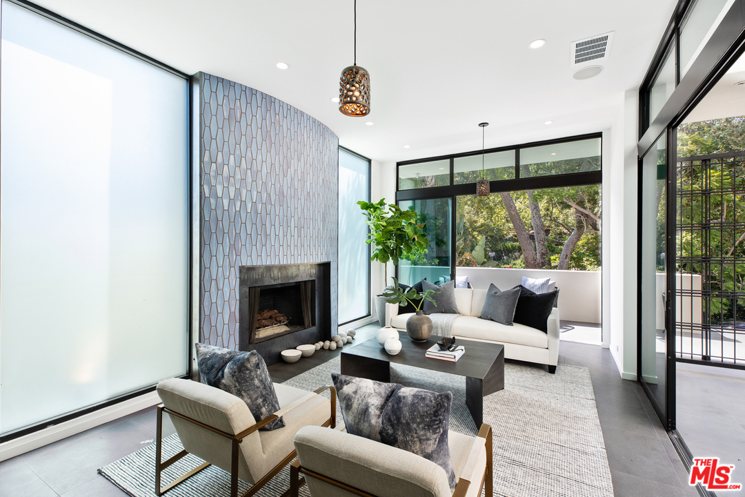 640 East Channel Road Santa Monica, CA 90402 - Photo 6 of 45 a living room with furniture and a fireplace