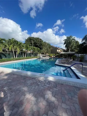 a view of a park with large trees