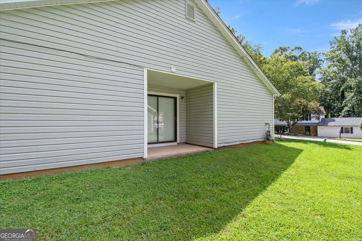 5426 Martins Crossing Road Stone Mountain, GA 30088 - Photo 22 of 26 a view of a backyard with a garden
