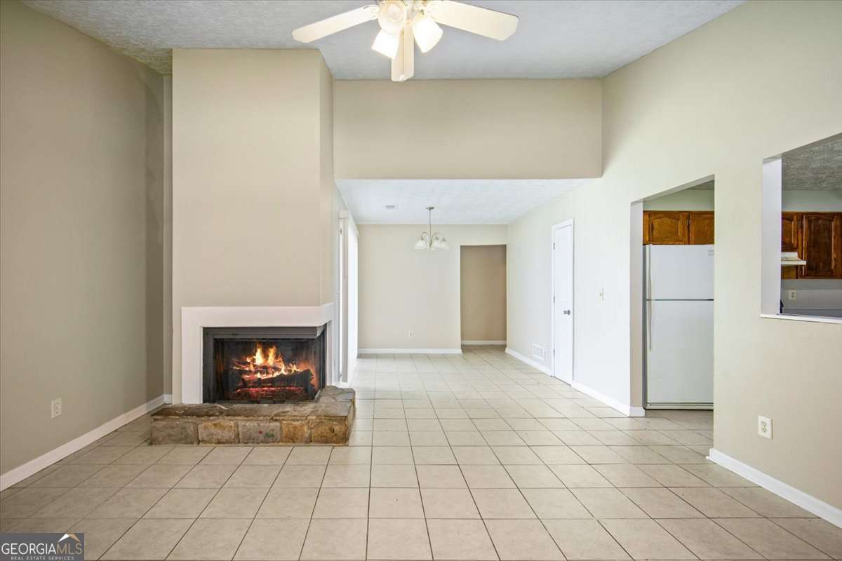 5426 Martins Crossing Road Stone Mountain, GA 30088 - Photo 5 of 26 a view of an empty room with a fireplace