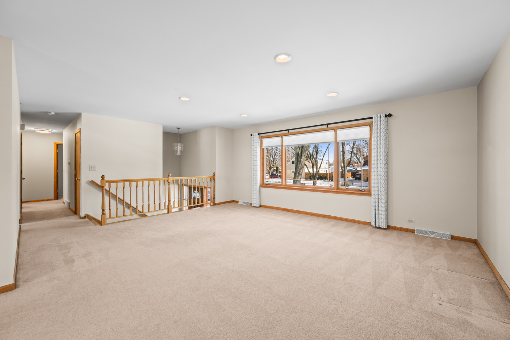 496 Raupp Boulevard Buffalo Grove, IL 60089 - Photo 3 of 19 a view of an empty room with a window