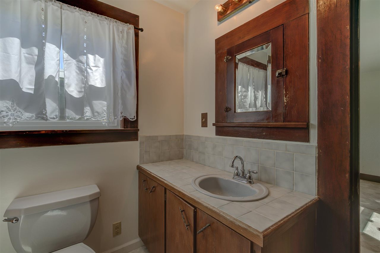 6110 Napa Road Corning, CA 96021 - Photo 38 of 62 a bathroom with a toilet sink and mirror