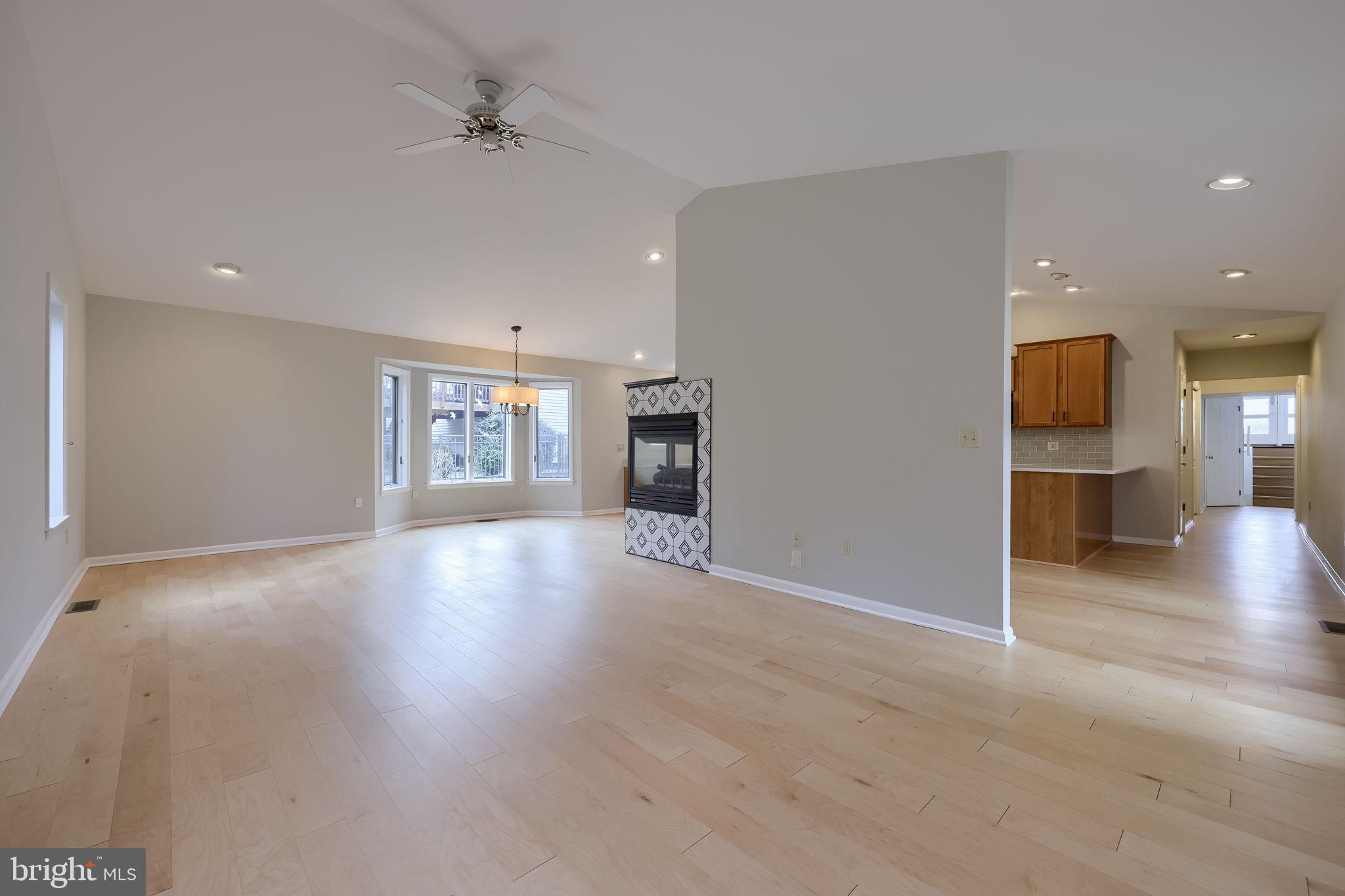 421 Longmeadow Road Lancaster, PA 17601 - Photo 13 of 44 an empty room with wooden floor and windows