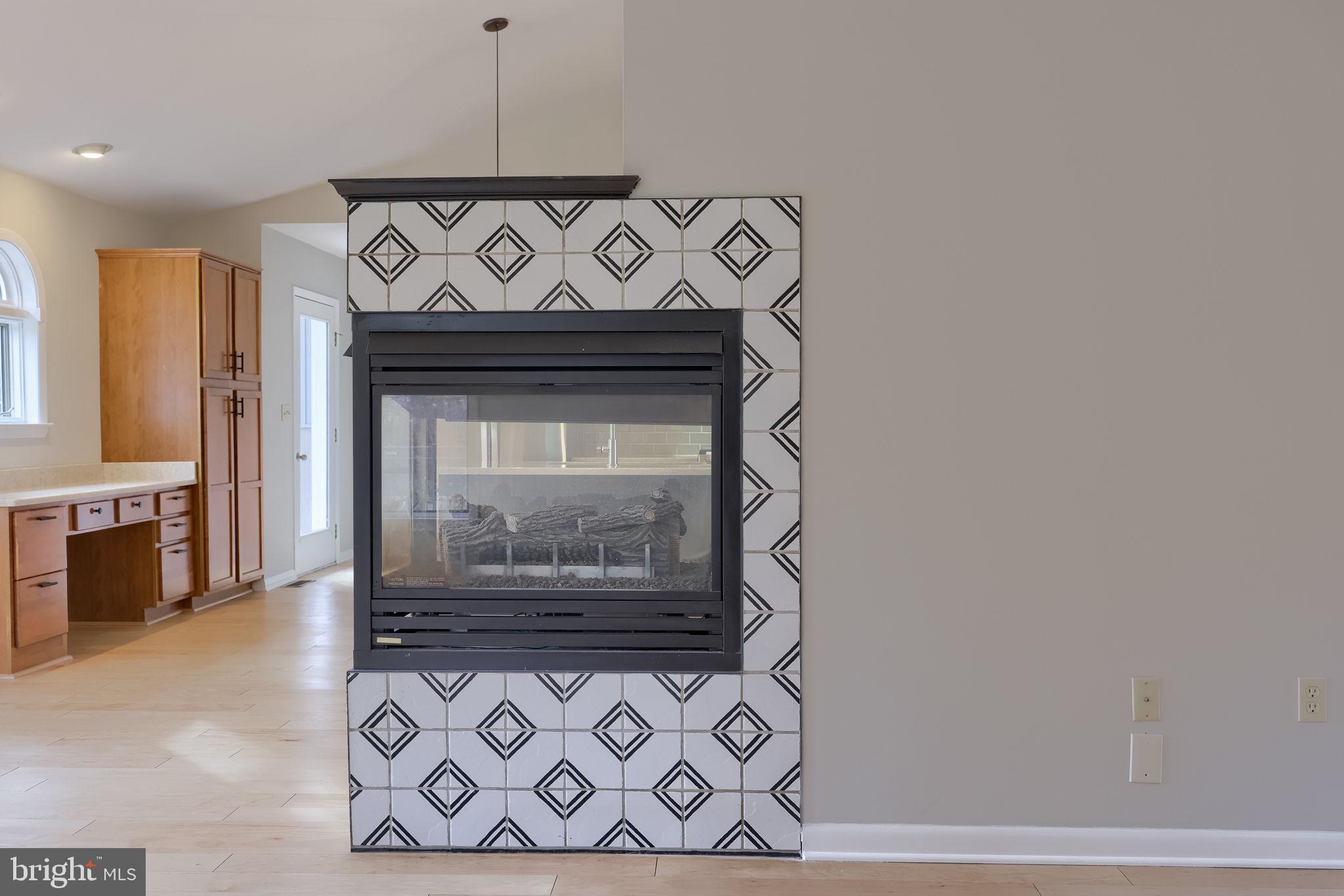 421 Longmeadow Road Lancaster, PA 17601 - Photo 14 of 44 a view of a fireplace with a wooden floor